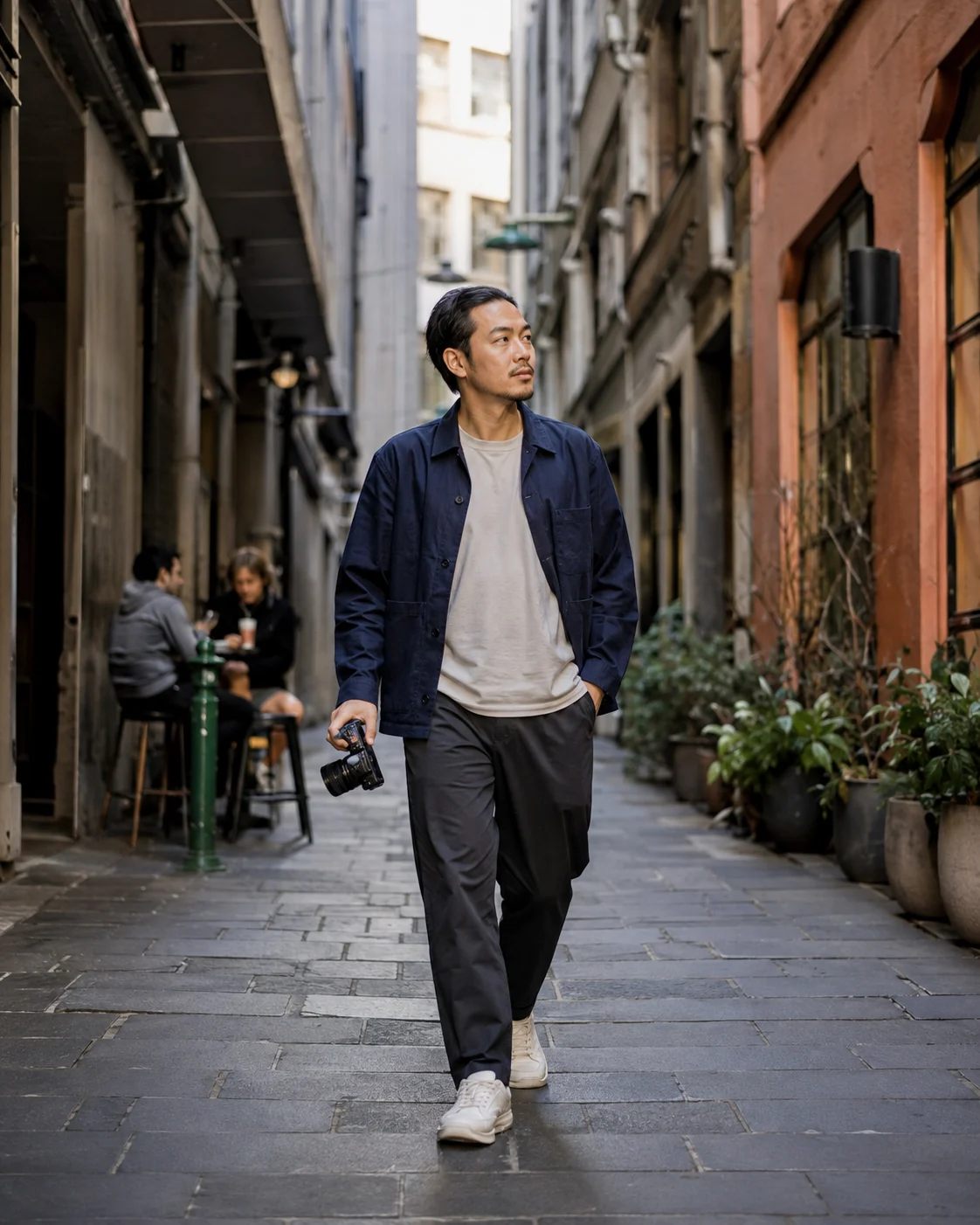 Portrait of a photographer walking in a Melbourne laneway